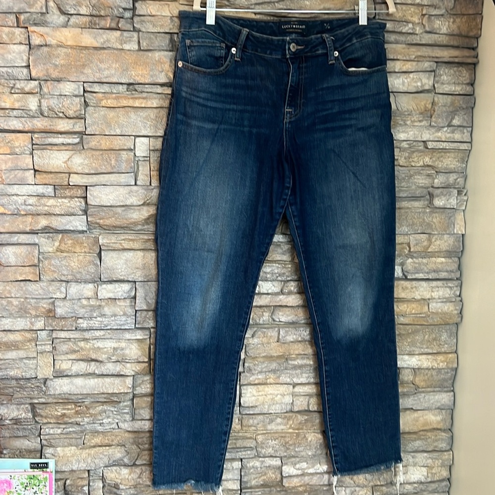 Lucky brand jeans worn on the front frayed at ankle not a super skinny leg